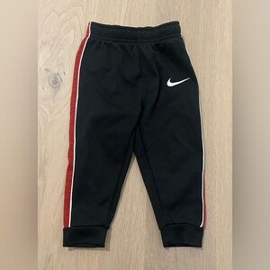 Nike Kids Black Joggers with Red and White Accents.   Therma Fit
